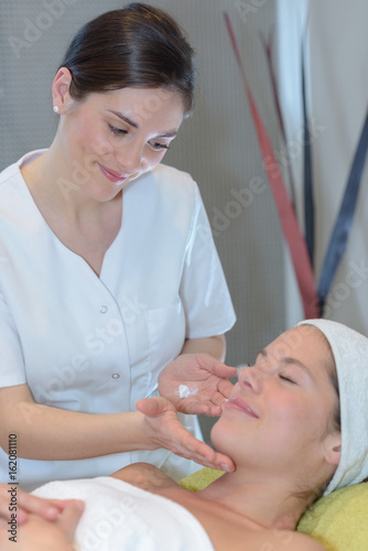 young pretty woman takes spa treatments