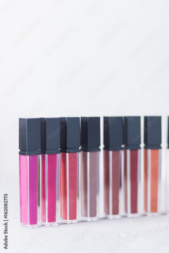professional cosmetics, bright lipstick, standing on white background, close-up, beauty, & table, Studio, beauty salon
