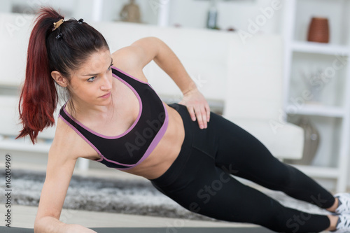 happy healthy woman practicing fitness home
