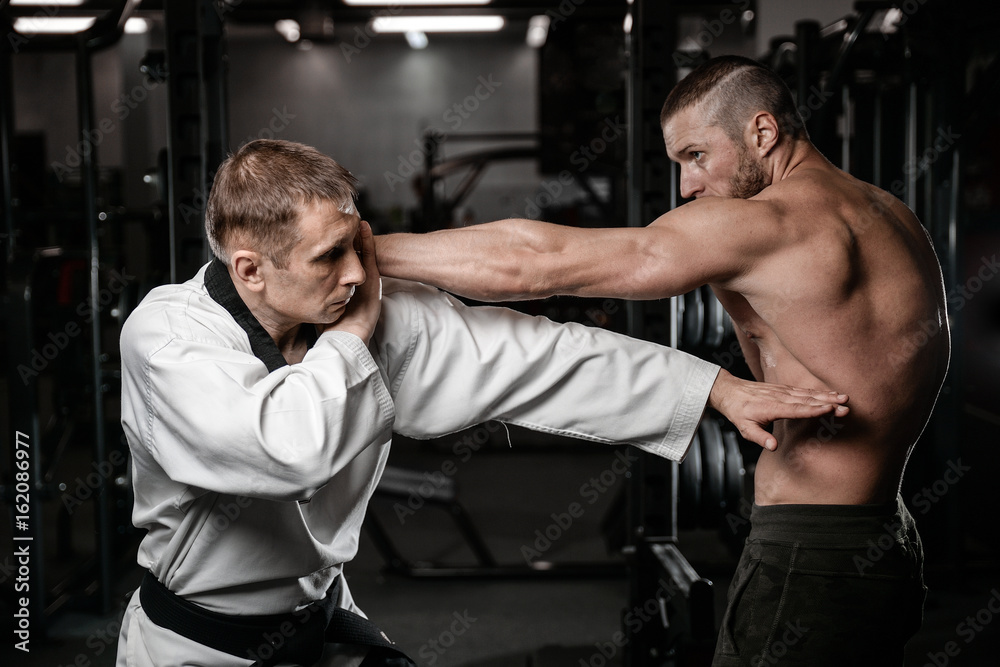 Martial arts fighters in gym Martial arts fighters in gym