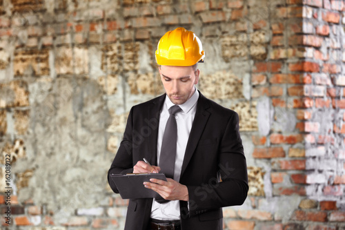 Φωτογραφία Insurance adjuster in abandoned building