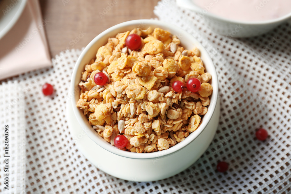 Breakfast cereal with cranberries and sunflower seeds on table Breakfast cereal with cranberries and sunflower seeds on table