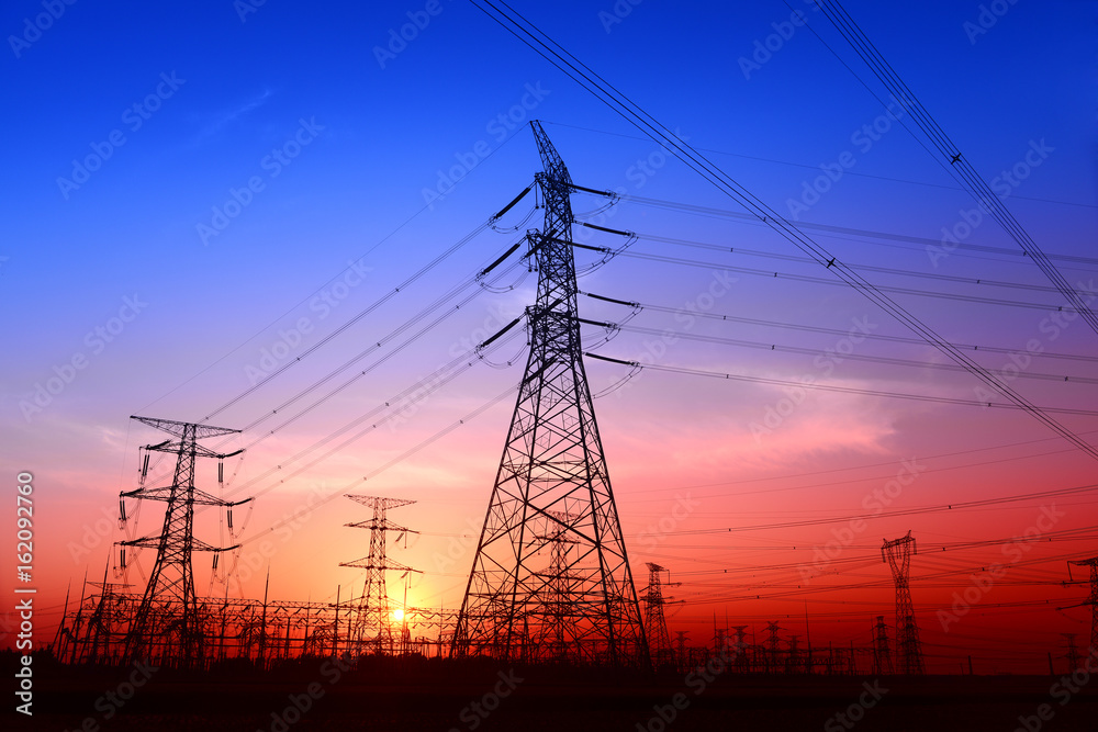 High piezoelectric towers, in the setting sun