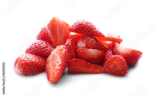 Pieces of tasty red strawberries on white background, closeup