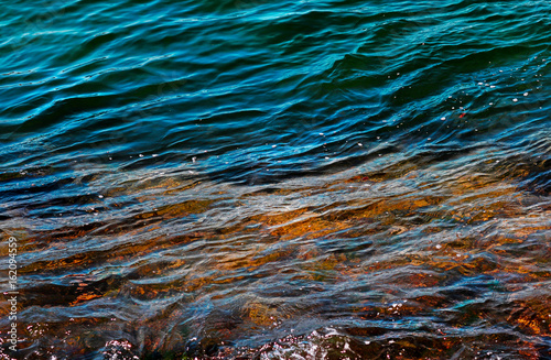 Light Reflections on Rippling Ocean Water