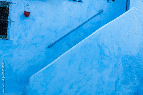 blue stairs in the streets of chefchaouen - morocco