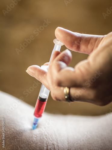 The procedure for injecting drugs at home close-up.