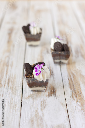 Trifle black and white chocolate with cookie, sweet dessert.