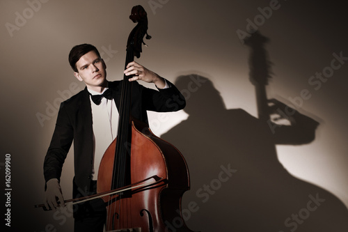 Double bass player playing contrabass