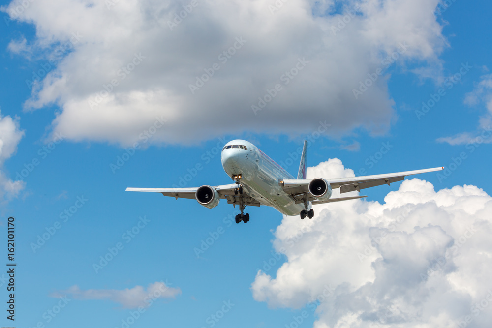 Flying plane against a blue sky