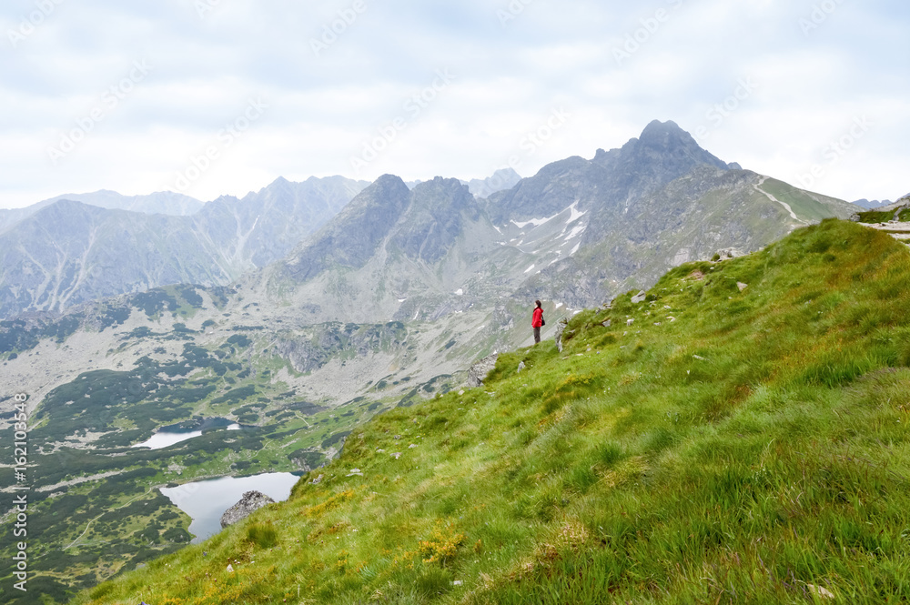 Person with arms outstretched to the nature