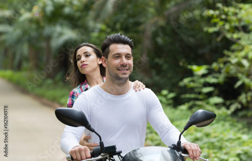 Couple Riding Motorcycle, Young Man Woman Happy Smiling Tourist Travel Bike Tropical Forest Exotic Vacation Summer Holiday