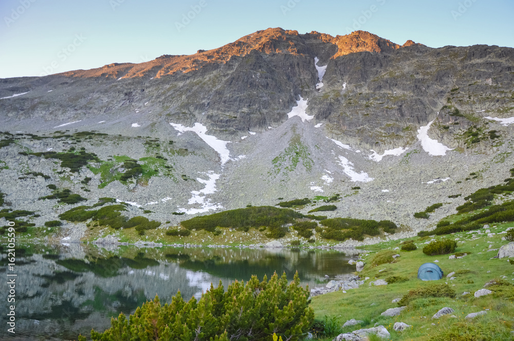 Tent near lake in mountains