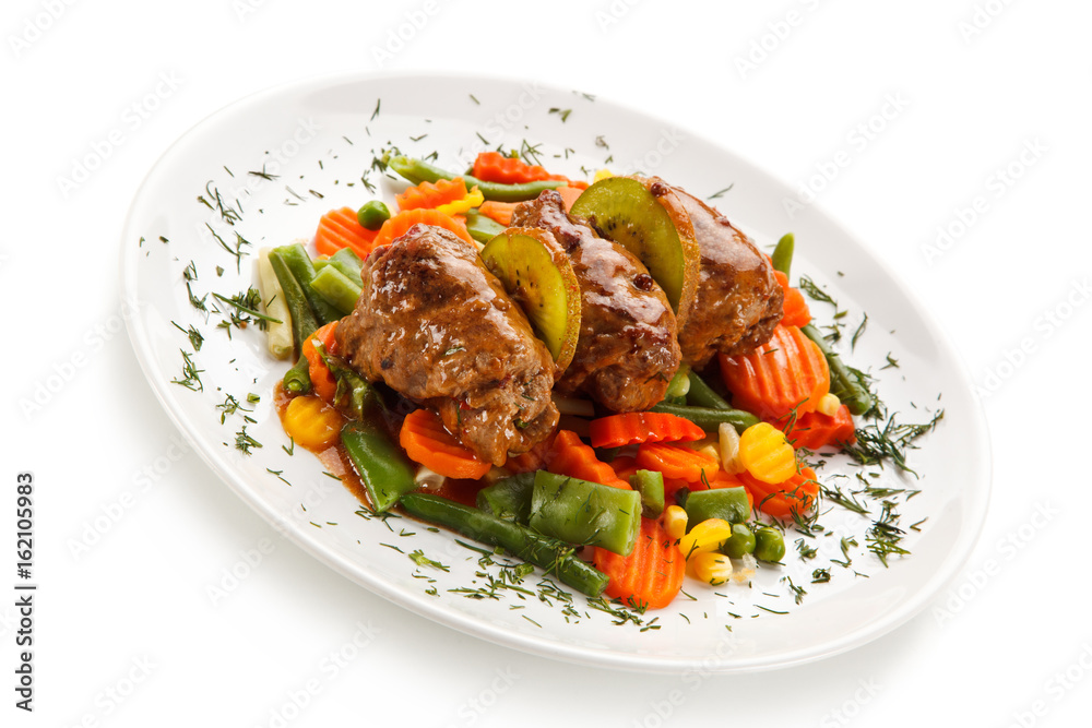 Wrapped pork chops and vegetables on white background 