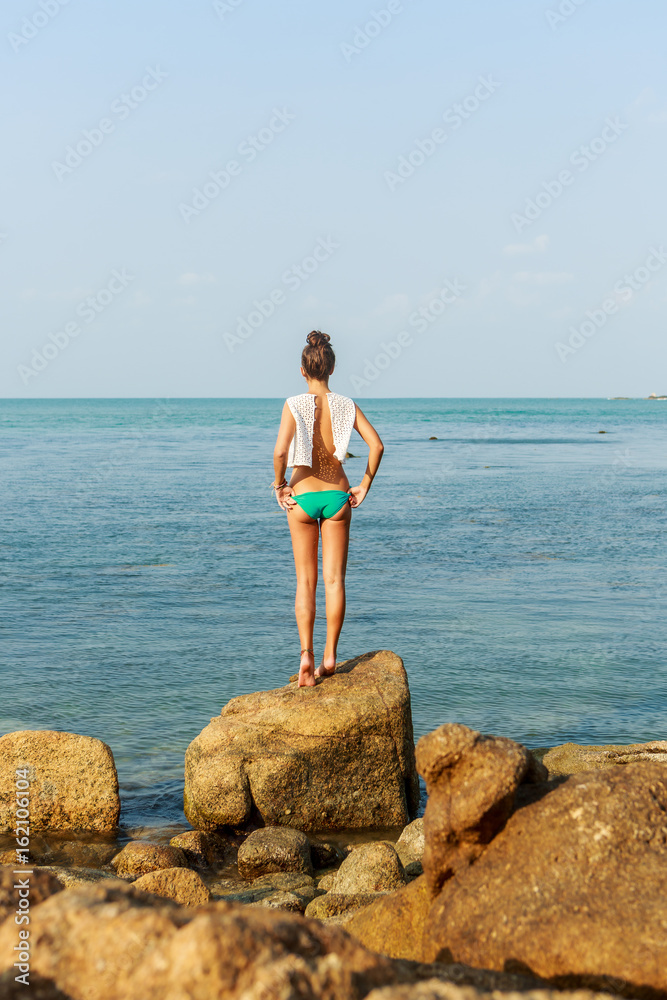 Young Lady In Bikini Standing On Sand Rocks Stock Photo, Picture and  Royalty Free Image. Image 18135805.