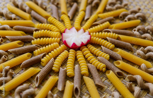 noodles, pasta of different kinds, scattered on the table. photo