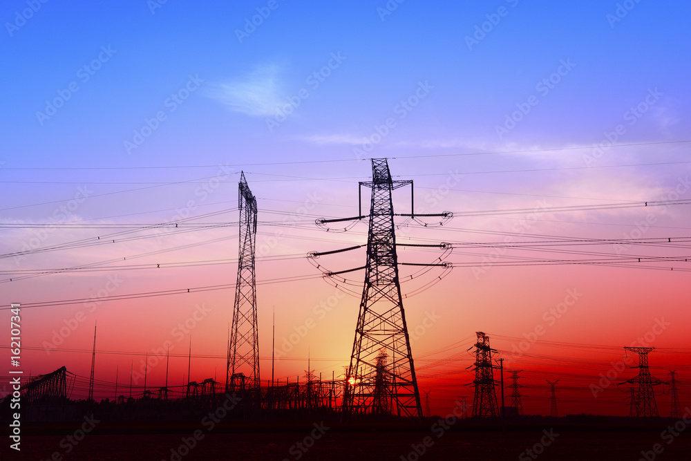 High piezoelectric towers, in the setting sun
