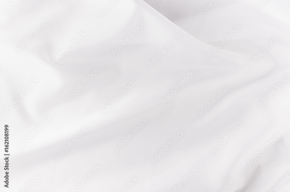 Obraz premium White smooth luxury silk or satin texture with liquid waves for wedding background.