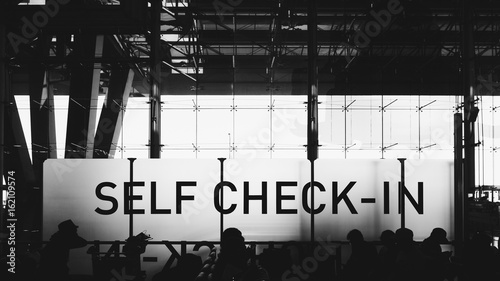 Self check-in sign at airport.