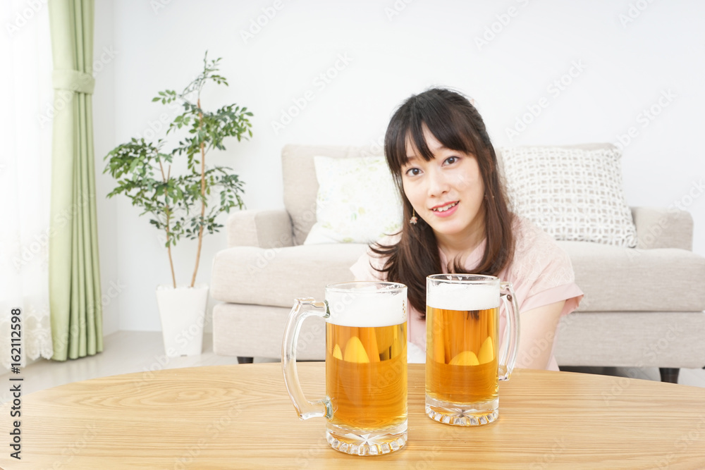 Young woman drinking beer