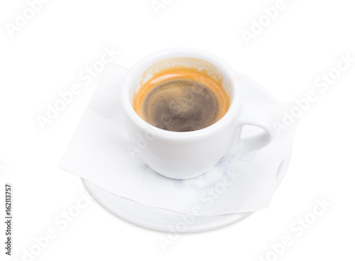 Espresso cup on a plate.