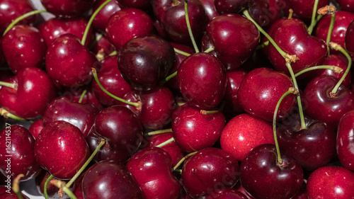 cherry detail macro of delicious fresh ripe red cherries with bright green stem, perfect food background Sweet cherry background. Cherry from Bolea Aragon Huesca Spain