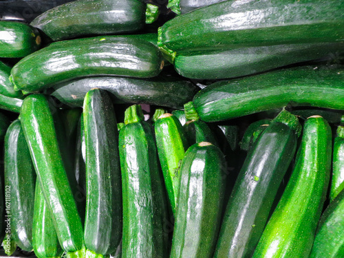 Fresh green zucchini in a box in the bazaar.