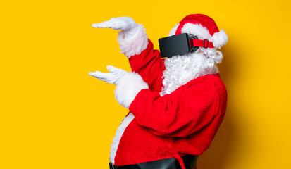 Funny Santa Claus have a joy with VR glasses