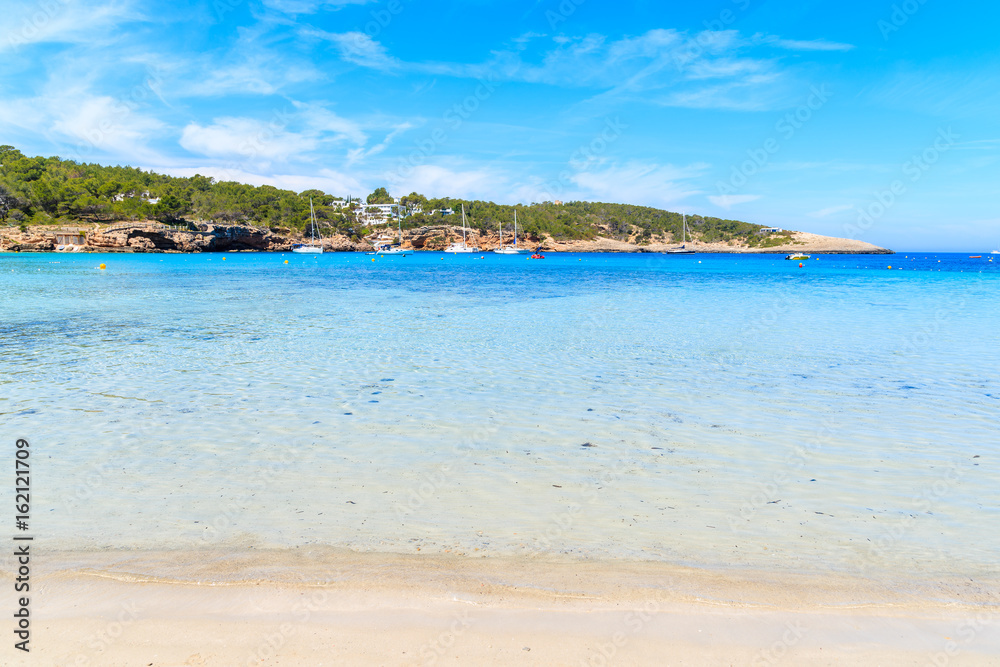 Sandy beach in Cala Portinatx bay, Ibiza island, Spain Sandy beach in Cala Portinatx bay, Ibiza island, Spain