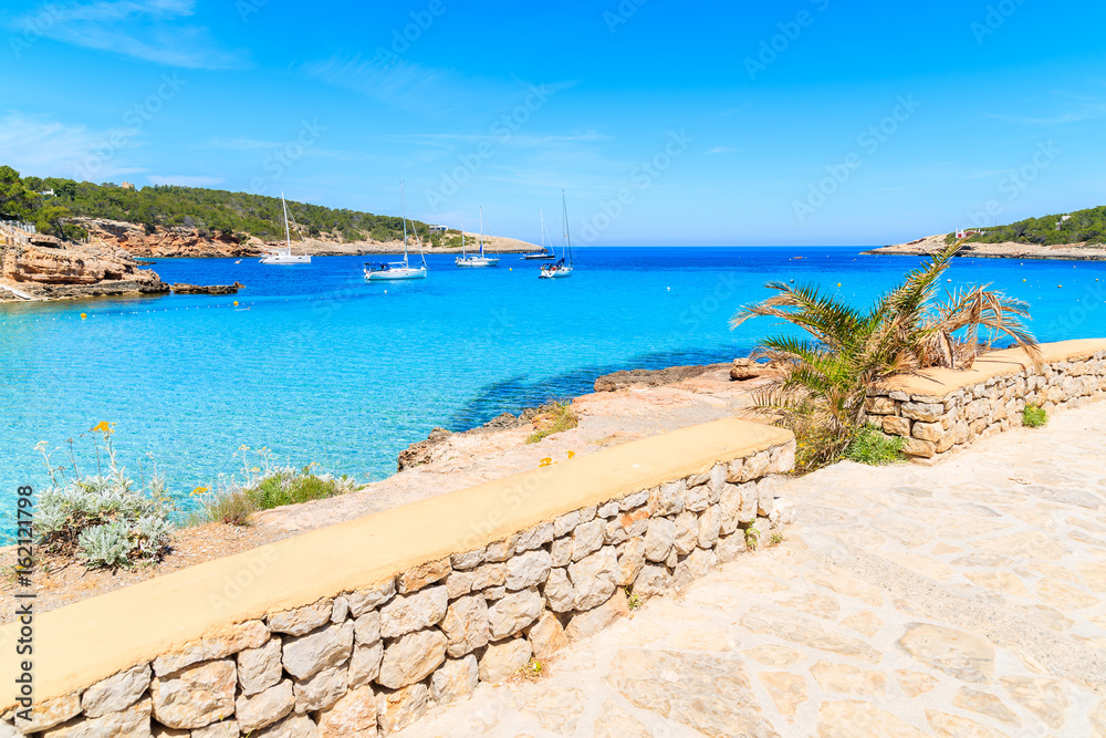 View of beautiful coast and blue sea in Cala Portinatx bay, Ibiza island, Spain