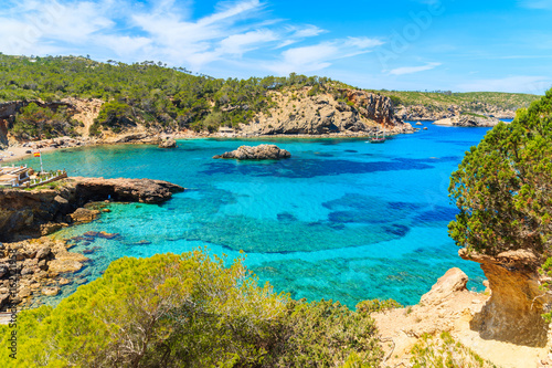 Bild auf Leinwand Amazing view of Cala Xarraca bay with azure sea water on northern coast of Ibiza