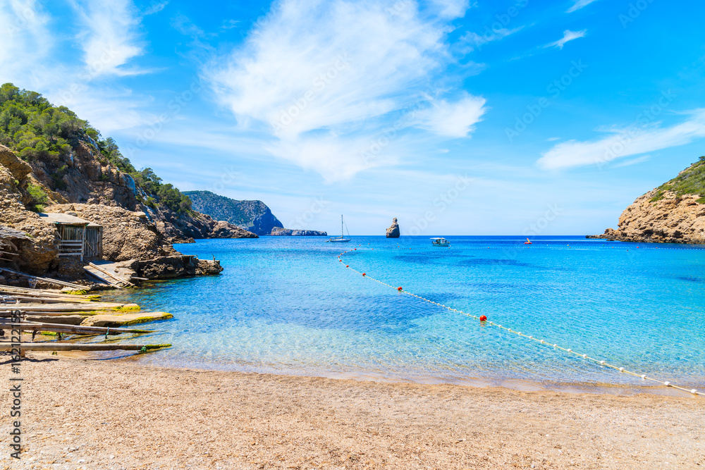 View of Cala Benirras beach with azure blue sea water, Ibiza island, Spain