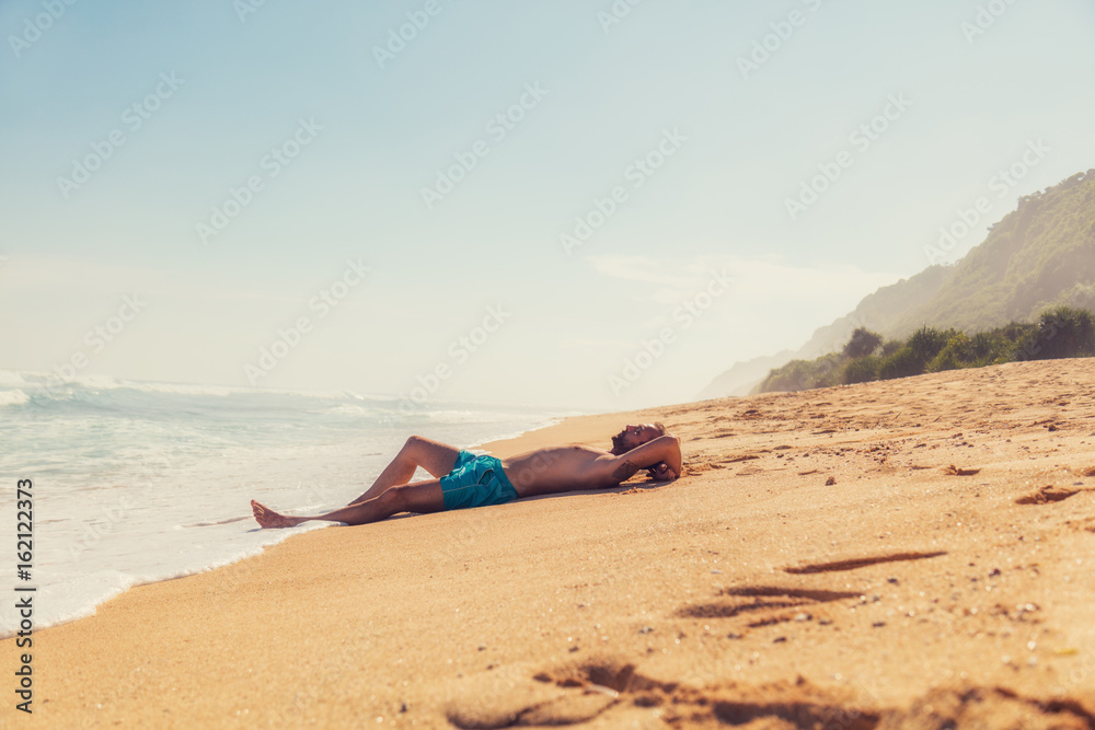 Man enjoying on empty tropical exotic beach. Man enjoying on empty tropical exotic beach.