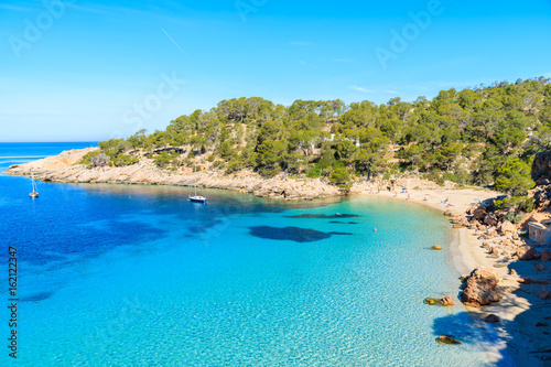 View of beautiful beach in Cala Salada famous for its azure crystal clear sea water, Ibiza island, Spain © pkazmierczak