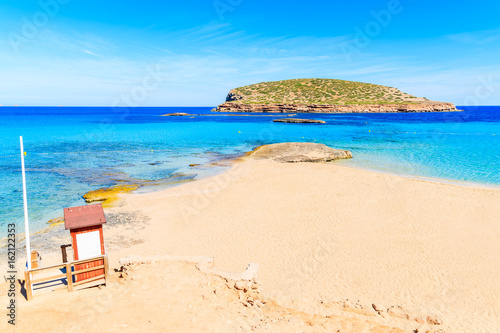 Lifeguard tower on beautiful Cala Comte beach famous for its azure crystal clear shallow sea water  Ibiza island  Spain