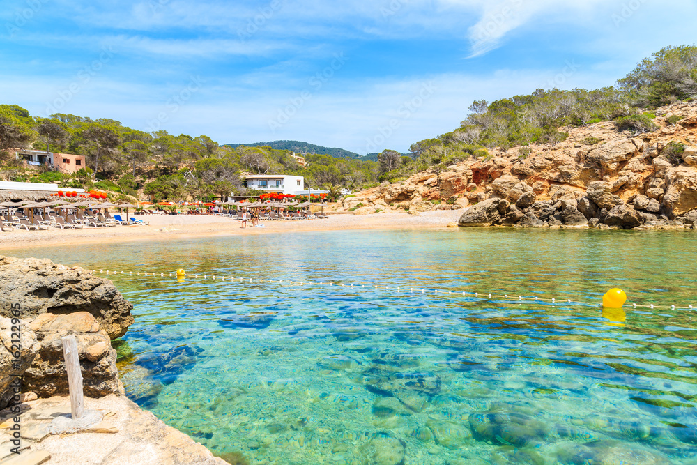 View of beautiful Cala Carbo bay with emerald green sea water, Ibiza island, Spain