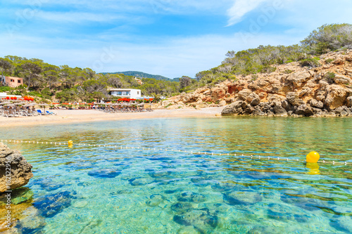 View of beautiful Cala Carbo bay with emerald green sea water, Ibiza island, Spain