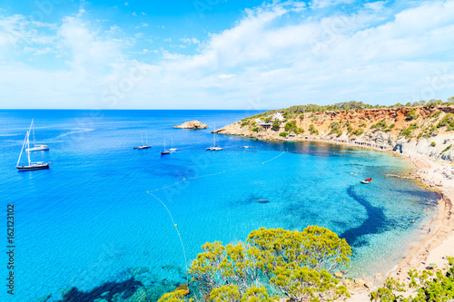 Fototapeta Naklejka Na Ścianę i Meble -  View of Cala d'Hort bay with beautiful azure blue sea water, Ibiza island, Spain