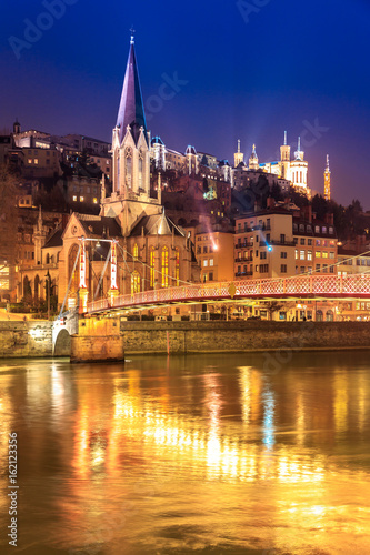 View of Saone river, Famous church in Lyon city at evening