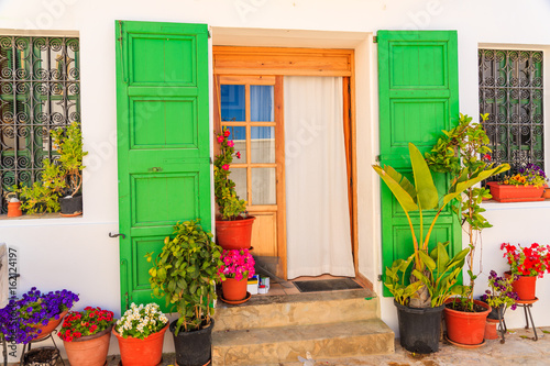 Flower pots in front of typical house in Sant Joan de Labritja village, Ibiza island, Spain © pkazmierczak