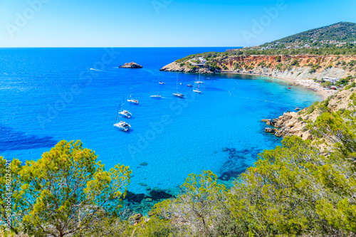 Fototapeta Naklejka Na Ścianę i Meble -  View of Cala d'Hort beach with beautiful azure blue sea water, Ibiza island, Spain
