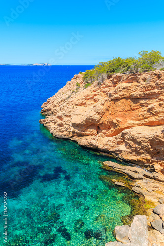 Sea cove with turquoise sea water near Punta Galera bay, Ibiza island, Spain