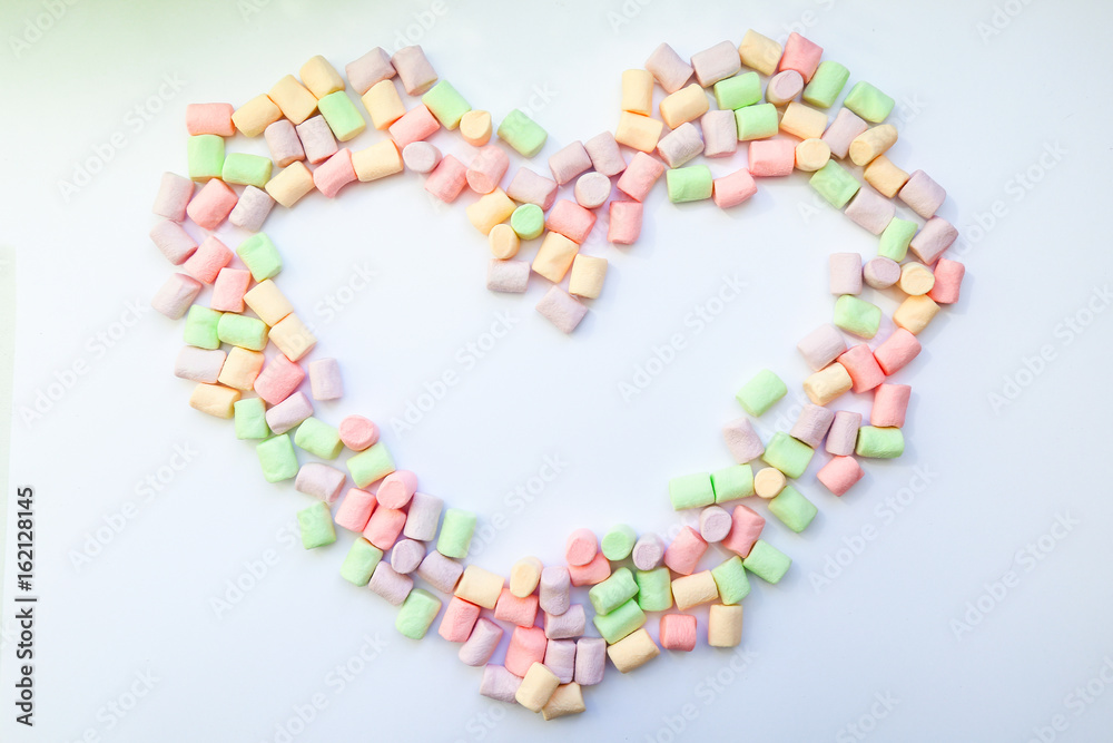 frame heart made of marshmallows . the concept of childhood. frame heart made of marshmallows . the concept of childhood.