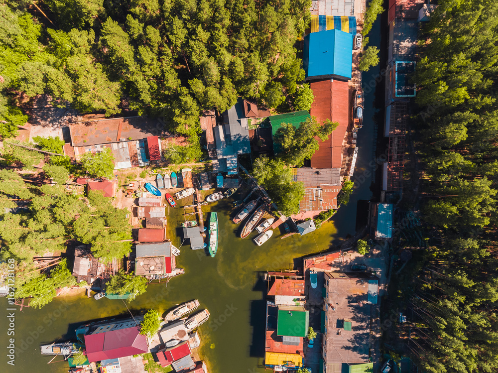 Aerial view to the boat station in lagoon Moored boats and yachts