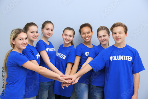 Team of volunteers putting ...