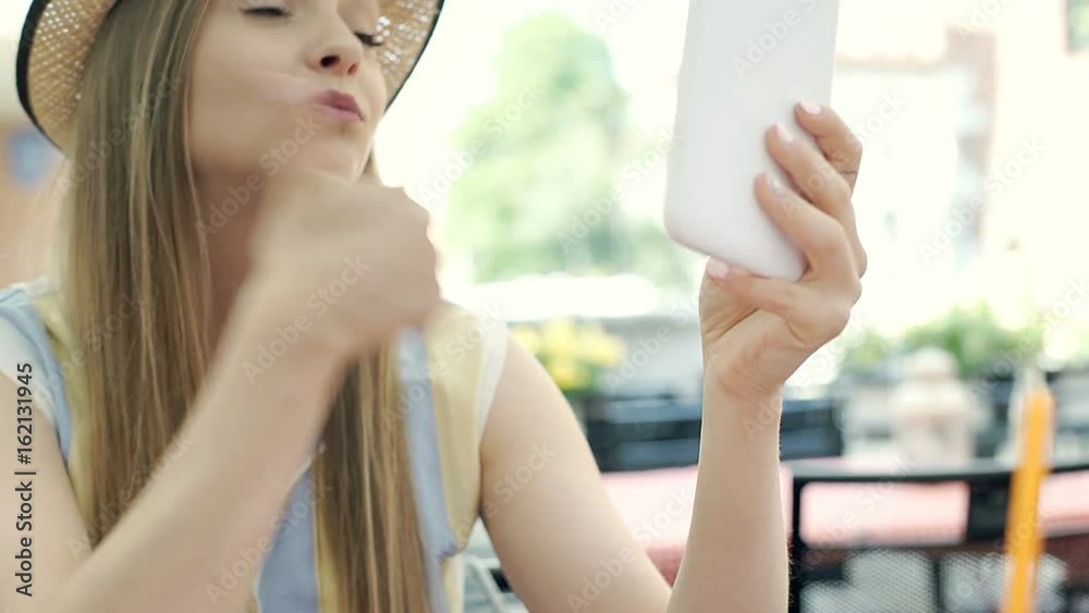 Happy girl eating tasty dessert and having a videochat on tablet, steadycam shot
Happy girl eating tasty dessert and having a videochat on tablet, steadycam shot