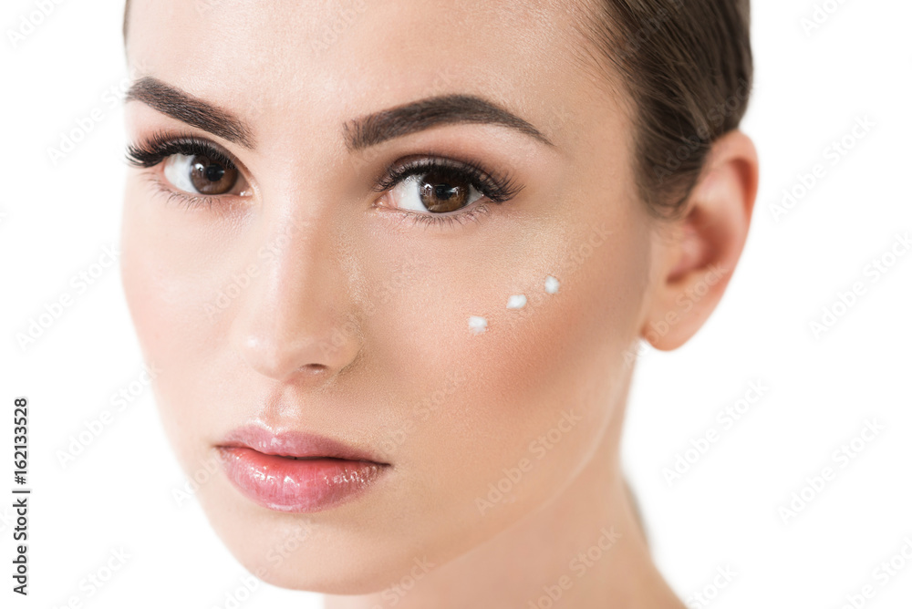 Serious attractive girl with decorative cosmetics on face Serious attractive girl with decorative cosmetics on face