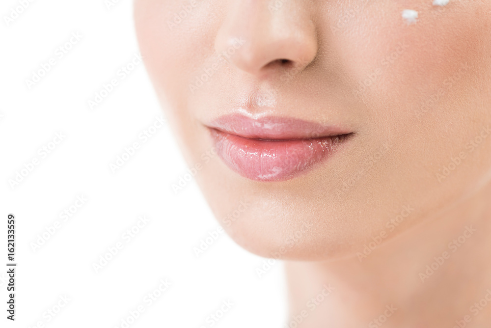 Lower face of youthful woman using visage cosmetics Lower face of youthful woman using visage cosmetics