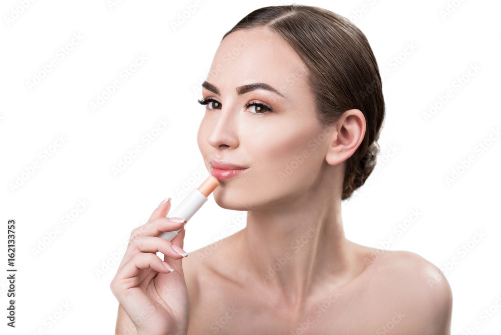 Cheerful attractive girl using visage make-up Cheerful attractive girl using visage make-up