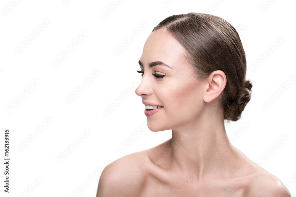 Cheery attractive girl using cosmetics for face Cheery attractive girl using cosmetics for face